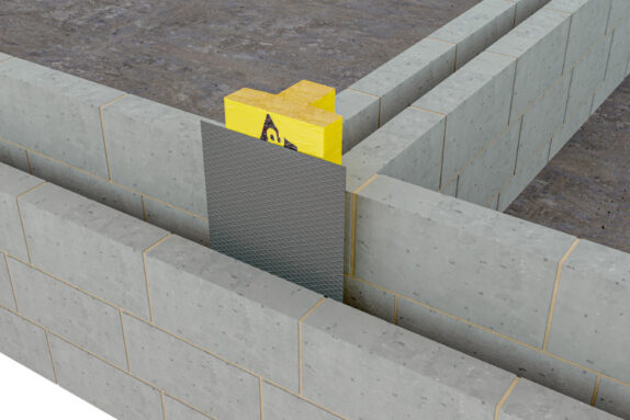 ARC T-Barrier Foundation providing firestopping at the foundation of a construction at the party wall. A grey damp proof course protects from moisture.